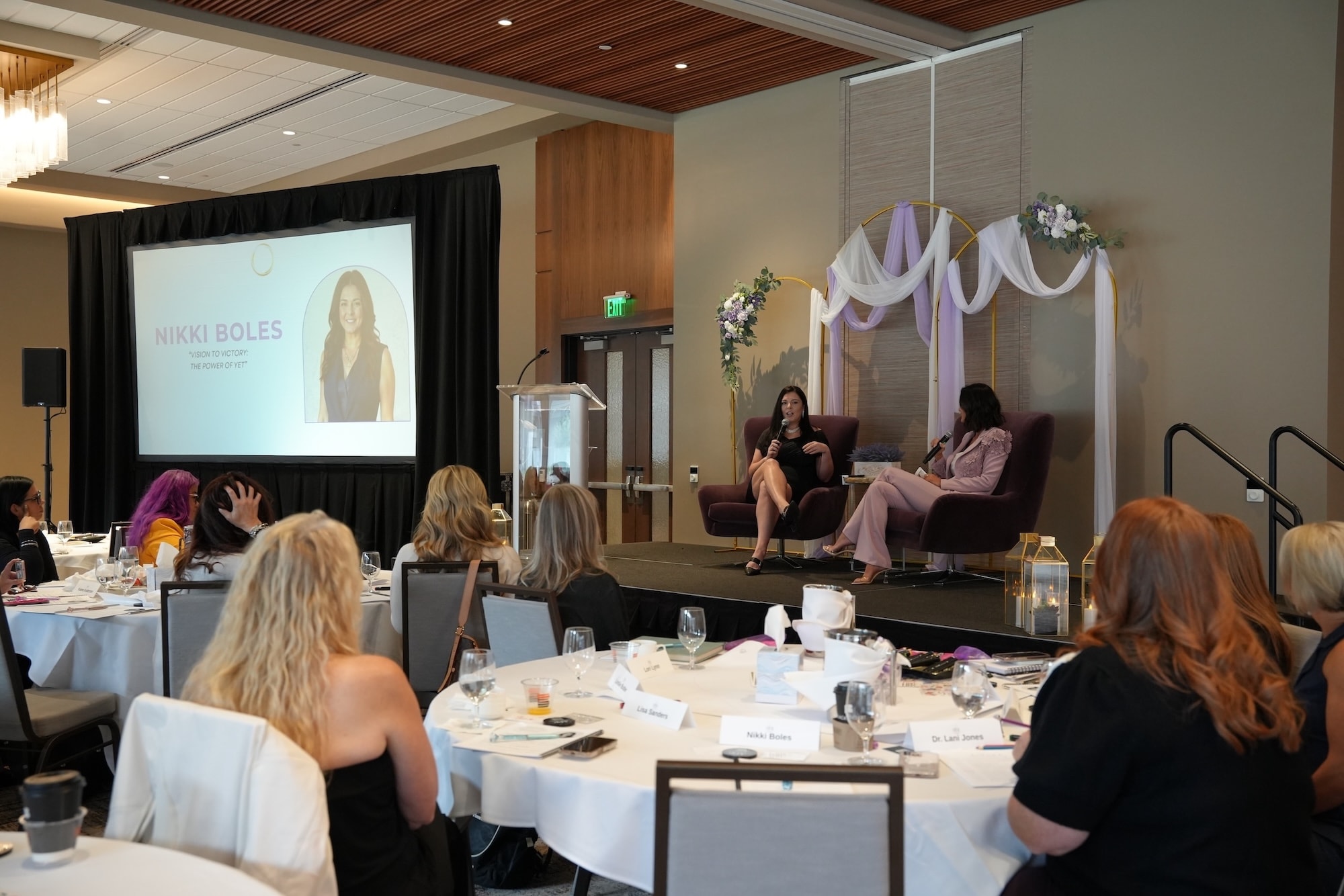 Nikki Boles presenting at the 2025 HER Success Summit